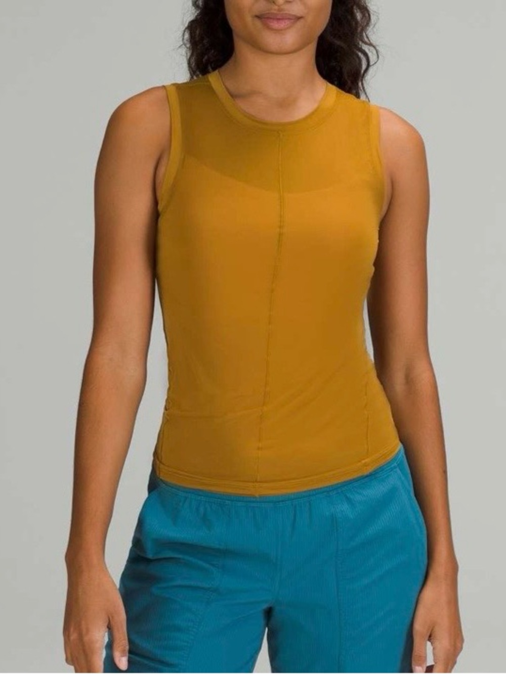 Used Lululemon Lightweight Jersey Tank-
Gold Spice top (some stains on the back)